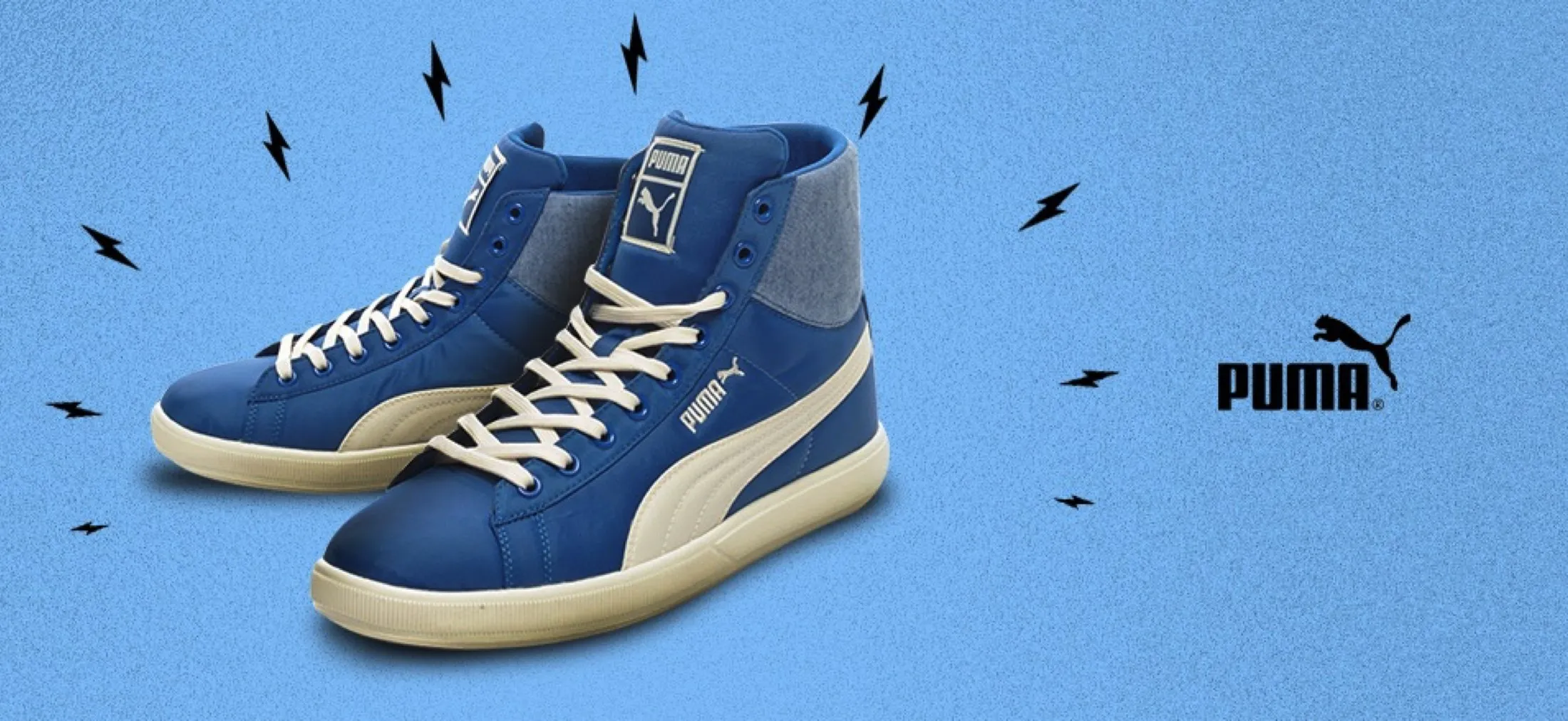 Product banner: blue suede Puma sneakers on a blue background with little lightning marks.