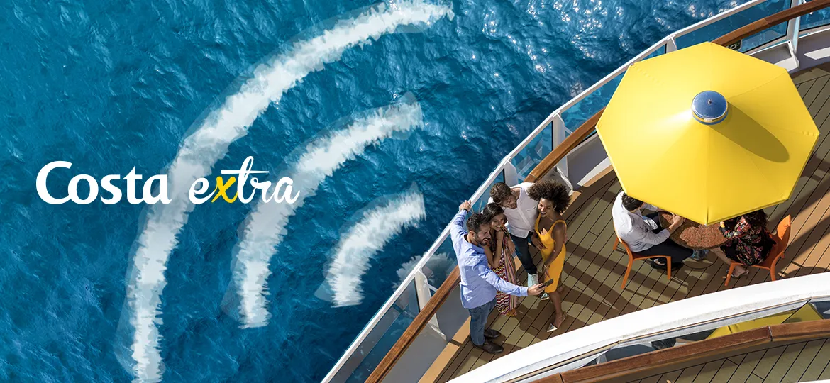 Costa extra: a deck with yellow parasols seen from above, the wake drawing a wi-fi sign in the sea.