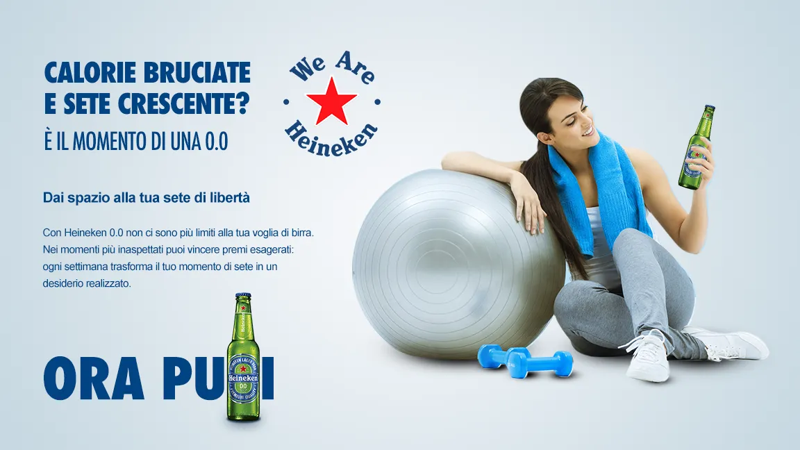 A woman resting on a gym ball with a Heineken 0.0: “Calories burned and thirst rising? Now you can.”
