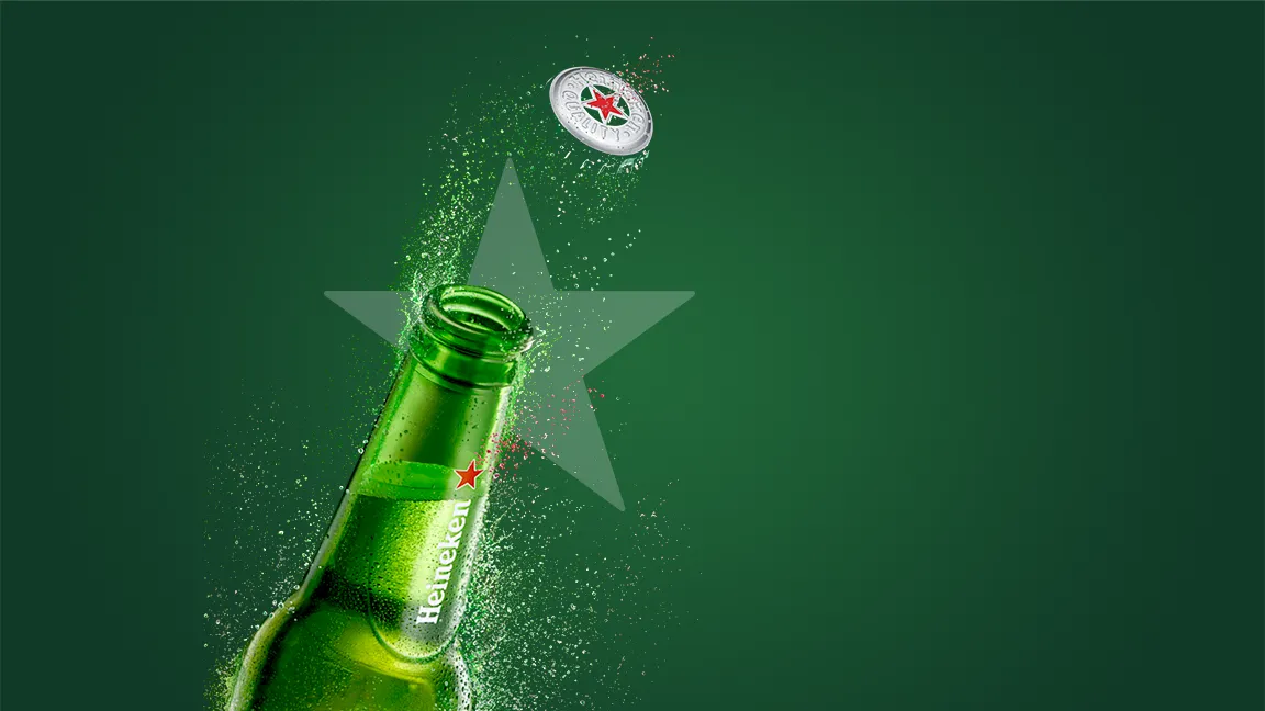 A Heineken bottle bursts open on green, its cap flying off in front of a red star.