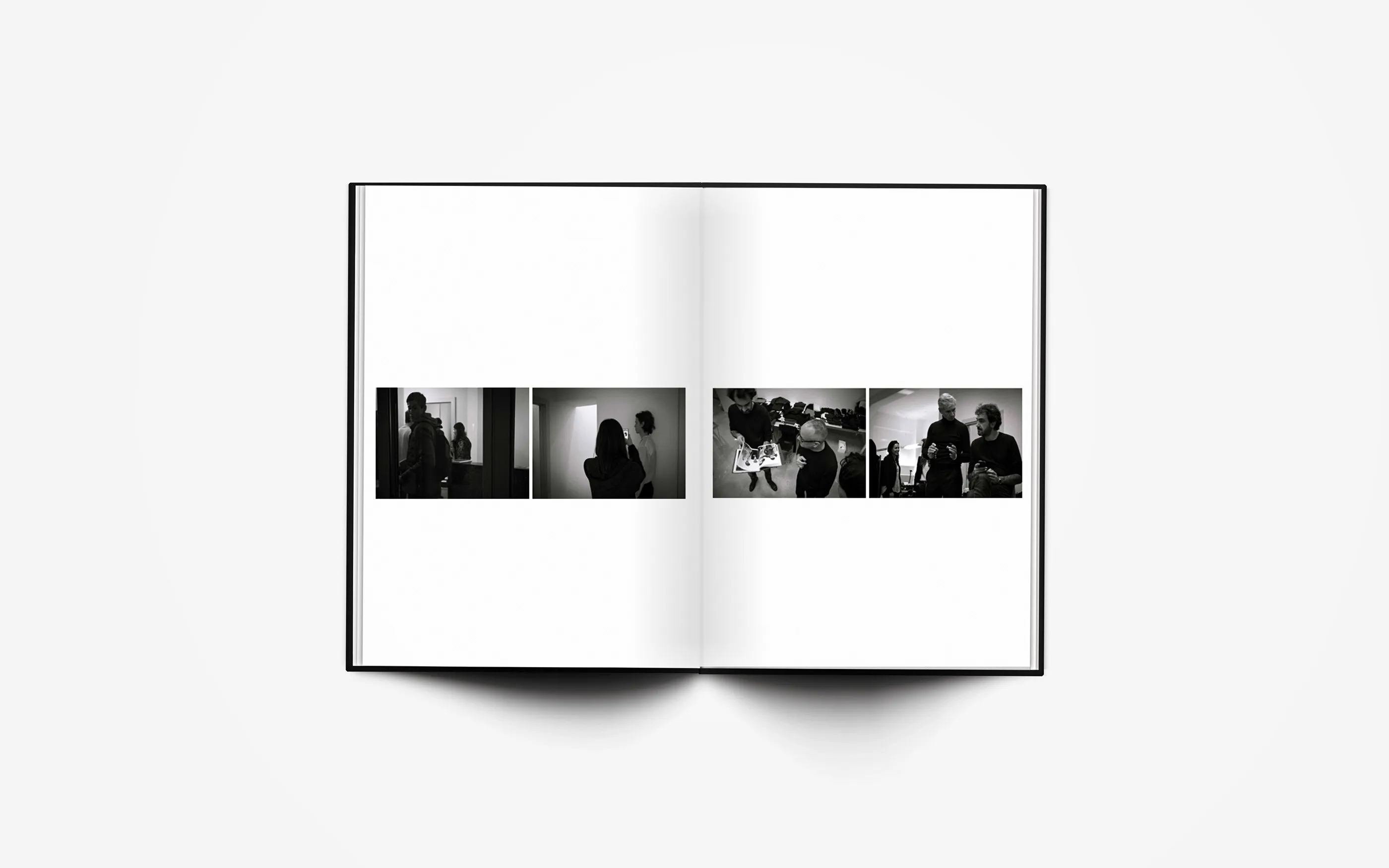 Open spread of the book: four small backstage photographs in a row across the gutter, models waiting in a room.