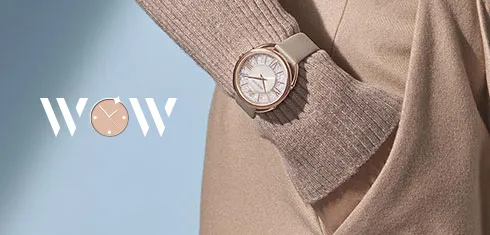 Swarovski WOW: a woman’s wrist with a watch, and the word WOW.