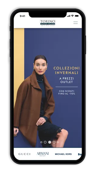 Torino Outlet Village home page on a phone, with the winter collections banner and the brands below.